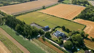 Offers over £3,000,000 for this unique contemporary home arranged on 3 floors with 6.24 acres, stabling for 6 horses, a floodlit outdoor  manège and separate self contained studio flat. Offers over £3,000,000