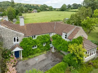 A period village home with annexe, outbuildings, land and stables, offering significant potential